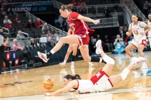 Nebraska Cornhusker Kennadi Williams (15) dives for the ball during a college basketball game against Indiana on Mar 4th, 2026, in Indianapolis, Indiana. Photo by Brandon Tiedemann