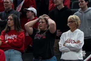 Nebraska Cornhusker fan stands in shock after a college basketball game against Indiana on Mar 4th, 2026, in Indianapolis, Indiana. Photo by Brandon Tiedemann