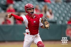 Nebraska Cornhusker catcher Jeter Worthley (0) throws to first to complete the out against Omaha Maverick infielder Henry Zipay (1) during a college baseball game on Tuesday, March 3, 2026, in Lincoln, Nebraska. Photo by John S. Peterson.