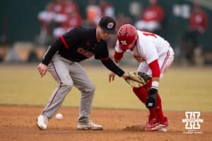 Nebraska Cornhusker infielder Dylan Carey (15) drops the ball trying to get out Nebraska Cornhusker Devin Nunez (16) advancing to second on a wild pitch during a college baseball game on Tuesday, March 3, 2026, in Lincoln, Nebraska. Photo by John S. Peterson.