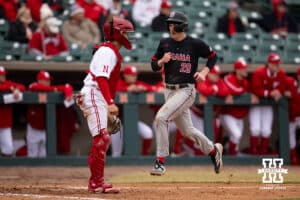 Omaha Maverick utility Jackson Trout (20) scores a run in the sixth inning against the Nebraska Cornhuskers during a college baseball game on Tuesday, March 3, 2026, in Lincoln, Nebraska. Photo by John S. Peterson.