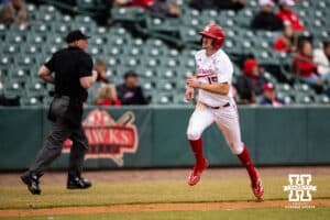 Nebraska Cornhusker infielder Dylan Carey (15) runs home for a run against the Omaha Mavericks in the second inning during a college baseball game on Tuesday, March 3, 2026, in Lincoln, Nebraska. Photo by John S. Peterson.