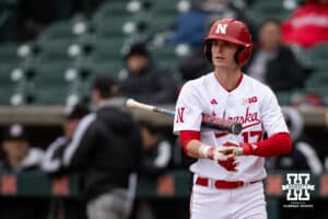 Nebraska Cornhusker outfielder Mac Moyer (17) snugs up his gloves before his at-bat against the Omaha Mavericks in the first inning during a college baseball game on Tuesday, March 3, 2026, in Lincoln, Nebraska. Photo by John S. Peterson.