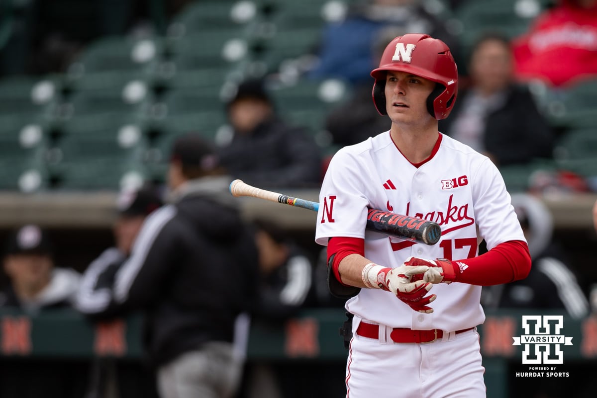 Nebraska Cornhusker outfielder Mac Moyer (17) snugs up his gloves before his at-bat against the Omaha Mavericks in the first inning during a college baseball game on Tuesday, March 3, 2026, in Lincoln, Nebraska. Photo by John S. Peterson.