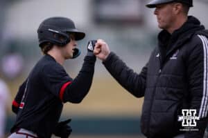Omaha Maverick infielder Tyler Bishop (2) gets a fist bumps rounding third after hitting a two run home run against the Nebraska Cornhuskers in the first inning during a college baseball game on Tuesday, March 3, 2026, in Lincoln, Nebraska. Photo by John S. Peterson.