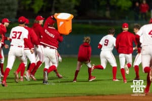 Nebraska Cornhusker Rhett Stokes (9) celebrates his walk off single against the Kansas State Wildcats in the ninth during a college baseball game at Haymarket Park on Tuesday, April 28, 2026, in Lincoln, Neb. Photo by John S. Peterson.