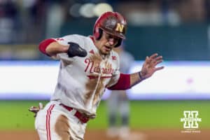 Nebraska Cornhusker Josh Overbeek (4) making sure he steps on third as he runs home for the walk-off win against the Kansas State Wildcats in the ninth during a college baseball game at Haymarket Park on Tuesday, April 28, 2026, in Lincoln, Neb. Photo by John S. Peterson.