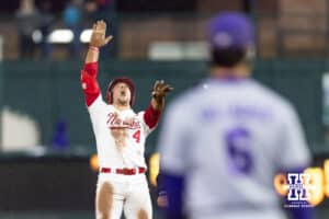 Nebraska Cornhusker Josh Overbeek (4) celebrates at second base after hitting a double against the Kansas State Wildcats in the ninth inning during a college baseball game at Haymarket Park on Tuesday, April 28, 2026, in Lincoln, Neb. Photo by John S. Peterson.