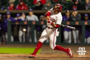 Nebraska Cornhusker Josh Overbeek (4) hits a double in the ninth inning against the Kansas State Wildcats during a college baseball game at Haymarket Park on Tuesday, April 28, 2026, in Lincoln, Neb. Photo by John S. Peterson.