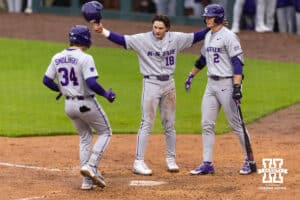 Kansas State Wildcat Ty Smolinski (34) celebreates his two-run home run with Micah Kendrick and Cadyn Karl against the Nebraska Cornhuskers in the fourth inning during a college baseball game at Haymarket Park on Tuesday, April 28, 2026, in Lincoln, Neb. Photo by John S. Peterson.