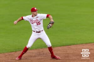 Nebraska Cornhusker infielder Dylan Carey (15) throws to first for an out against the Kansas State Wildcats in the fourth inning during a college baseball game at Haymarket Park on Tuesday, April 28, 2026, in Lincoln, Neb. Photo by John S. Peterson.