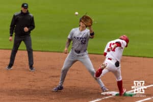 Nebraska Cornhusker Mac Moyer (17) beats the toss to first base in the second inning during a college baseball game at Haymarket Park on Tuesday, April 28, 2026, in Lincoln, Neb. Photo by John S. Peterson.