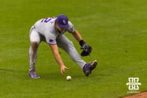 Kansas State Wildcat pitcher James Guyette (32) scoops up the ball from a Nebraska Cornhusker outfielder Mac Moyer (17) bunt in the first during a college baseball game at Haymarket Park on Tuesday, April 28, 2026, in Lincoln, Neb. Photo by John S. Peterson.