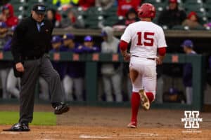 Nebraska Cornhusker Dylan Carey (15) scores a run in the first inning against the Kansas State Wildcats during a college baseball game at Haymarket Park on Tuesday, April 28, 2026, in Lincoln, Neb. Photo by John S. Peterson.