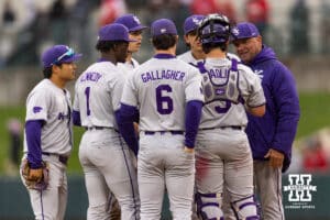 Kansas State Wildcats has a meeting on the mound against the Nebraska Cornhuskers in the first inning during a college baseball game at Haymarket Park on Tuesday, April 28, 2026, in Lincoln, Neb. Photo by John S. Peterson.