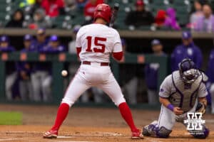 Kansas State Wildcat catcher Bear Madliak (3) loses track of the ball from a wild pitch as Nebraska Cornhusker Dylan Carey (15) is batting, Jeter Worthley scores in the first inning during a college baseball game at Haymarket Park on Tuesday, April 28, 2026, in Lincoln, Neb. Photo by John S. Peterson.