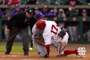 Nebraska Cornhusker Mac Moyer (17) scores a run on a wild pitch against Kansas State Wildcat pitcher James Guyette (32) in the first inning during a college baseball game at Haymarket Park on Tuesday, April 28, 2026, in Lincoln, Neb. Photo by John S. Peterson.