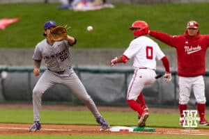 Nebraska Cornhusker Jeter Worthley (0) beats the ball to first base against Kansas State Wildcat infielder Chandler Murray (52) in the first inning during a college baseball game at Haymarket Park on Tuesday, April 28, 2026, in Lincoln, Neb. Photo by John S. Peterson.