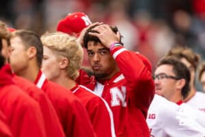 Nebraska Cornhusker pitcher J'shawn Unger (37) straightens up his hair taking his hat off before the National Anthem during a college baseball game against the Kansas State Wildcats at Haymarket Park on Tuesday, April 28, 2026, in Lincoln, Neb. Photo by John S. Peterson.