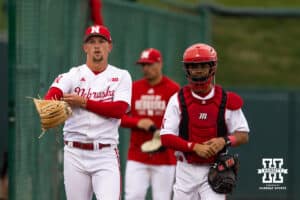 Nebraska Cornhusker pitcher Tucker Timmerman (32) and catcher Jeter Worthley (0) walk to the dugout to take on the Kansas State Wildcats during a college baseball game at Haymarket Park on Tuesday, April 28, 2026, in Lincoln, Neb. Photo by John S. Peterson.