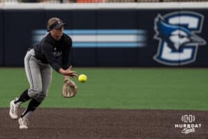 Omaha Mavericks Katherine Johnson (12) throws to first base during a college softball game on April 28, 2026, in Omaha, Nebraska. Photo by Brandon Tiedemann.