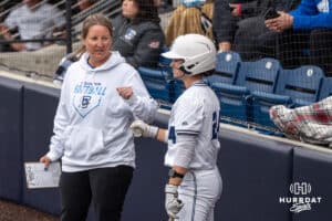 Creighton Bluejays head coach Krista Wood talks to her team during a college softball game on April 28, 2026, in Omaha, Nebraska. Photo by Brandon Tiedemann.