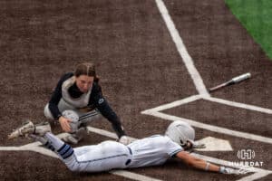 Omaha Mavericks Rylinn Groff (21) tags out Creighton Bluejay Ashten Pierson (4) during a college softball game on April 28, 2026, in Omaha, Nebraska. Photo by Brandon Tiedemann.