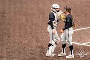 Omaha Mavericks Rylinn Groff (21) and Maddia Groff (6) talk during a college softball game on April 28, 2026, in Omaha, Nebraska. Photo by Brandon Tiedemann.