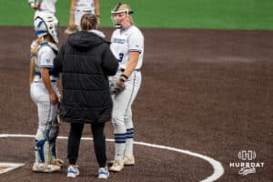Creighton Bluejays head coach Krista Wood talks with Audrey Gilman (3) during a college softball game on April 28, 2026, in Omaha, Nebraska. Photo by Brandon Tiedemann.