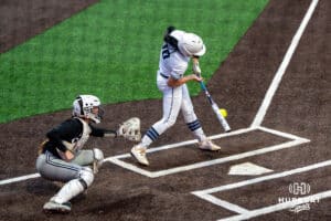 Creighton Bluejays Keegan Mayhue (10) hits during a college softball game on April 28, 2026, in Omaha, Nebraska. Photo by Brandon Tiedemann.