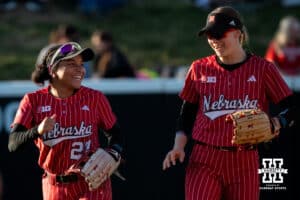 Nebraska outfielder Natalia Hill (27) talks with a teammate in between innings during a college women’s softball game, Apr. 24, 2026, Lincoln, Nebraska. Photo by Braden Cochran.