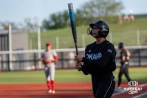 Omaha Maverick Ava Rongisch (23) walks up to bat during a college softball game against Nebraska on April 21, 2026, in Omaha, Nebraska. Photo by Brandon Tiedemann