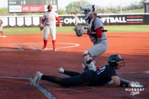 Omaha Maverick Sammy Schmidt (17) gets tagged out at home during a college softball game against Nebraska on April 21, 2026, in Omaha, Nebraska. Photo by Brandon Tiedemann
