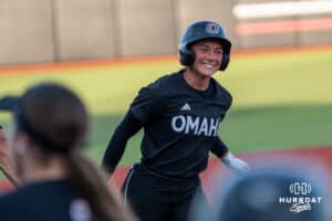 Omaha Maverick Marra Cramer (9) smiles after a homerun during a college softball game against Nebraska on April 21, 2026, in Omaha, Nebraska. Photo by Brandon Tiedemann