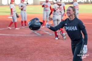 Omaha Maverick Marra Cramer (9) throws her helmet during a college softball game against Nebraska on April 21, 2026, in Omaha, Nebraska. Photo by Brandon Tiedemann