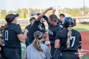 Omaha Mavericks celebrate a Marra Cramer (9) homerun during a college softball game against Nebraska on April 21, 2026, in Omaha, Nebraska. Photo by Brandon Tiedemann