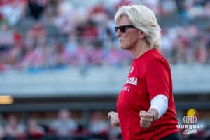 Nebraska Cornhusker head coach Rhonda Revelle signals during a college softball game against Omaha on April 21, 2026, in Omaha, Nebraska. Photo by Brandon Tiedemann