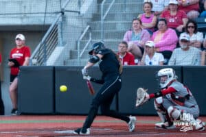 Omaha Maverick Alexis Wiggins (2) hits during a college softball game against Nebraska on April 21, 2026, in Omaha, Nebraska. Photo by Brandon Tiedemann