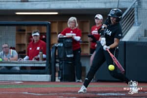 Omaha Maverick Sammy Schmidt (17) hits during a college softball game against Omaha on April 21, 2026, in Omaha, Nebraska. Photo by Brandon Tiedemann