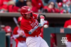 Nebraska Cornhusker Trey Fikes (21) hits a two-run single in the seventh inning for the win with a run-rule against the Southern California Trojans during a college baseball game on Saturday, April 18, 2026, in Lincoln, Neb. Photo by John S. Peterson.