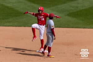 Nebraska Cornhusker infielder Case Sanderson (14) celebrates his one-run double in the sixth inning against the Southern California Trojans during a college baseball game on Saturday, April 18, 2026, in Lincoln, Neb. Photo by John S. Peterson.