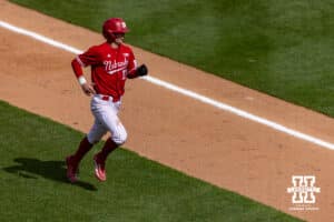 Nebraska Cornhusker Mac Moyer (17) scores a run from a Dylan Carey double in the sixth inning against the Southern California Trojans during a college baseball game on Saturday, April 18, 2026, in Lincoln, Neb. Photo by John S. Peterson.