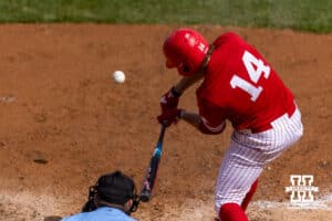 Nebraska Cornhusker Case Sanderson (14) hits a one-run double in the sixth inning against the Southern California Trojans during a college baseball game on Saturday, April 18, 2026, in Lincoln, Neb. Photo by John S. Peterson.