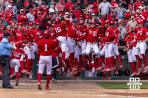 Nebraska Cornhuskers celebrate Dylan Carey's home run in the third inning against the Southern California Trojans during a college baseball game on Saturday, April 18, 2026, in Lincoln, Neb. Photo by John S. Peterson.