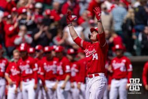 Nebraska Cornhusker Case Sanderson (14) looks to the sky as he crosses home plate after hitting a home run in the third against the Southern California Trojans during a college baseball game on Saturday, April 18, 2026, in Lincoln, Neb. Photo by John S. Peterson.