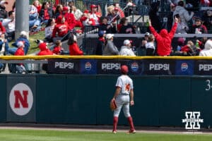Southern California Trojan Jack Basser (14) watches the home run ball from Nebraska Cornhusker infielder Case Sanderson (14) go over the wall in the third inning during a college baseball game on Saturday, April 18, 2026, in Lincoln, Neb. Photo by John S. Peterson.