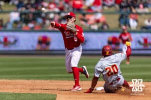 Nebraska Cornhusker infielder Rhett Stokes (9) forces out Southern California Trojan catcher Isaac Cadena (20) at second base in a double-play in the third inning during a college baseball game on Saturday, April 18, 2026, in Lincoln, Neb. Photo by John S. Peterson.