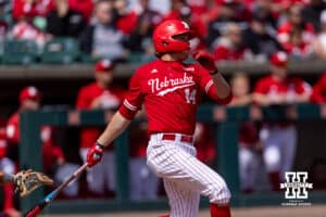 Nebraska Cornhusker infielder Case Sanderson (14) hits a home run against the Southern California Trojans in the third inning during a college baseball game on Saturday, April 18, 2026, in Lincoln, Neb. Photo by John S. Peterson.