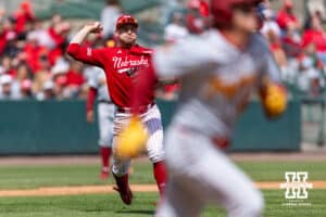 Nebraska Cornhusker infielder Josh Overbeek (4) throws out Southern California Trojan Will Stickney (40) at first on a bunt during a college baseball game on Saturday, April 18, 2026, in Lincoln, Neb. Photo by John S. Peterson.