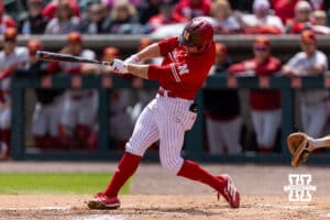 Nebraska Cornhusker Josh Overbeek (4) hits a one-run single in the first inning against the Southern California Trojans during a college baseball game on Saturday, April 18, 2026, in Lincoln, Neb. Photo by John S. Peterson.